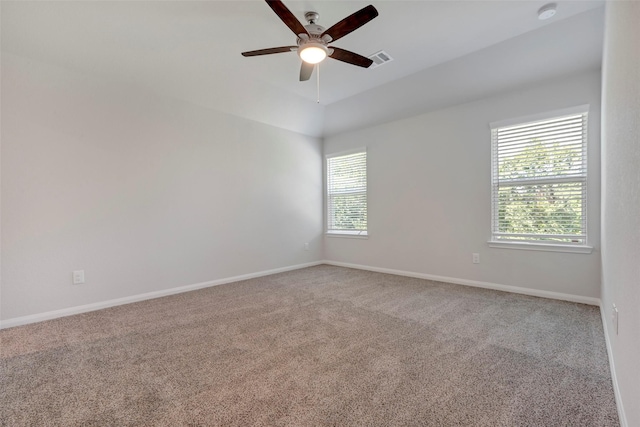 1316 Farquhar St, Navasota, TX 77868 - spare room featuring healthy amount of natural light, a smoke detector, carpet floors, and vaulted ceiling