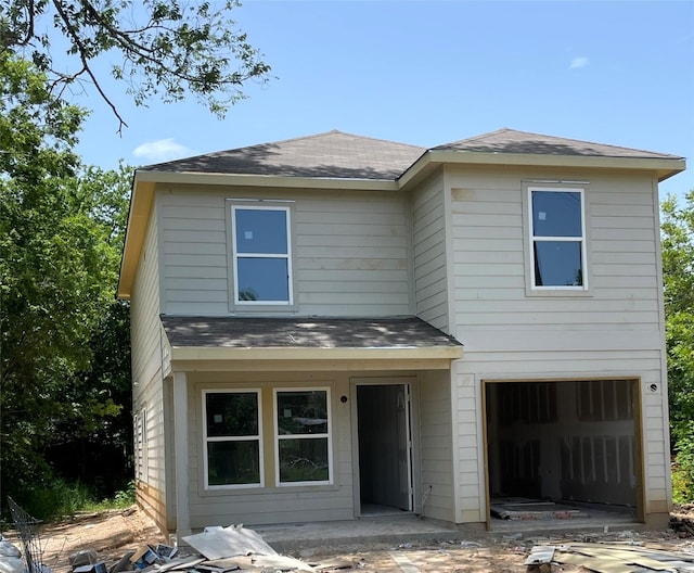 1316 Farquhar St, Navasota, TX 77868 - traditional-style house featuring an attached garage, a shingled roof, and concrete driveway