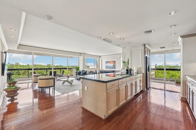 49 Briar Hollow Ln Unit 702, Houston, TX 77027 - kitchen with dark wood-style floors, recessed lighting, open floor plan, dark countertops, and expansive windows