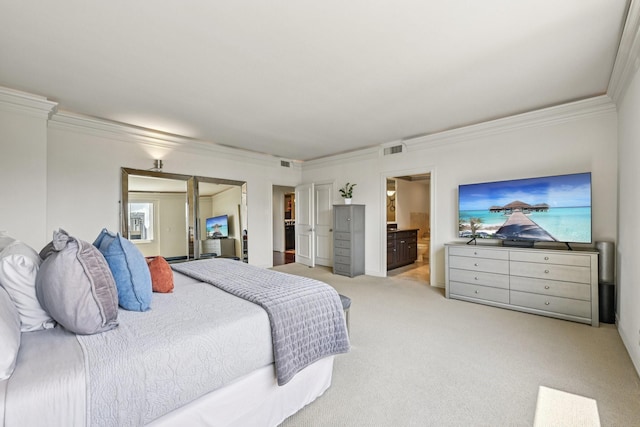 49 Briar Hollow Ln Unit 702, Houston, TX 77027 - bedroom with ornamental molding, light colored carpet, a walk in closet, and connected bathroom