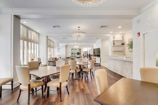 49 Briar Hollow Ln Unit 702, Houston, TX 77027 - dining room with dark wood finished floors, crown molding, and recessed lighting