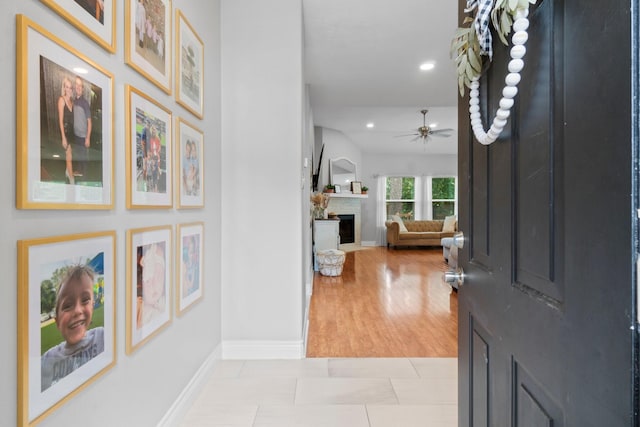23803 Spring Way Dr, Spring, TX 77373 - entrance foyer with ceiling fan, a fireplace, and recessed lighting