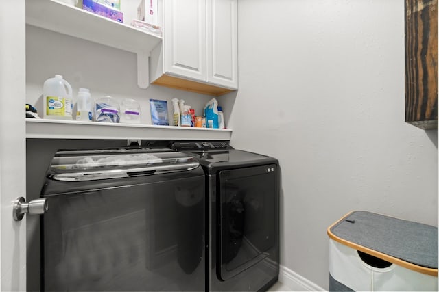 23803 Spring Way Dr, Spring, TX 77373 - laundry room with cabinet space and washing machine and clothes dryer