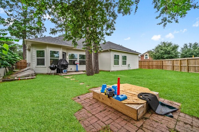 23803 Spring Way Dr, Spring, TX 77373 - back of house featuring a fenced backyard, a patio, and roof with shingles
