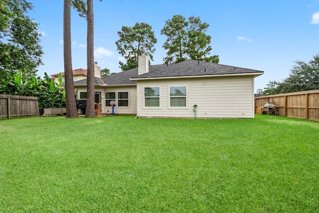 23803 Spring Way Dr, Spring, TX 77373 - back of house with a fenced backyard, a chimney, and a shingled roof