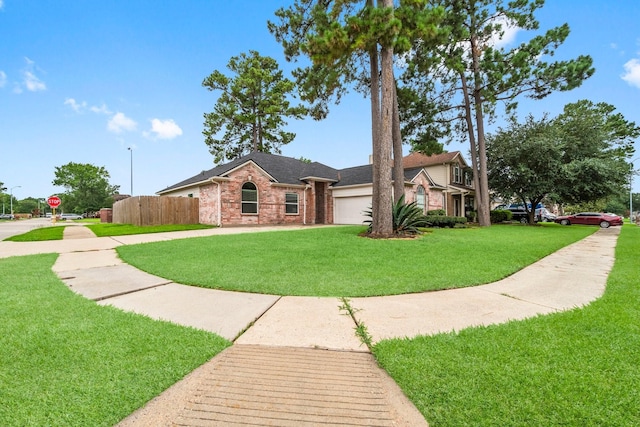 23803 Spring Way Dr, Spring, TX 77373 - view of front of home featuring brick siding, an attached garage, and roof with shingles