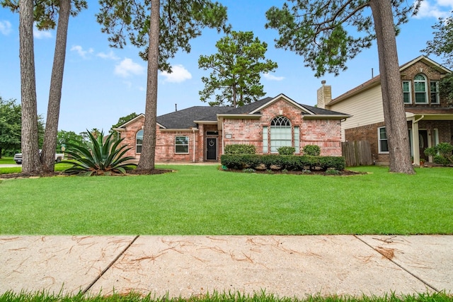 23803 Spring Way Dr, Spring, TX 77373 - view of front of property featuring brick siding and roof with shingles