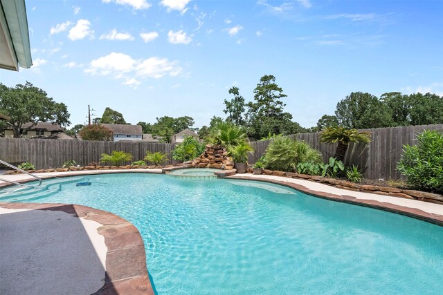 19511 Oak Station Dr, Humble, TX 77346 - view of pool with a fenced backyard and a pool with connected hot tub