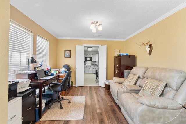 19511 Oak Station Dr, Humble, TX 77346 - office area with wood finished floors and crown molding