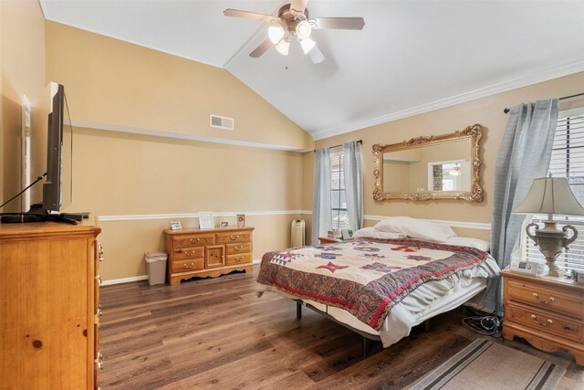 19511 Oak Station Dr, Humble, TX 77346 - bedroom with wood finished floors, radiator, vaulted ceiling, and ceiling fan