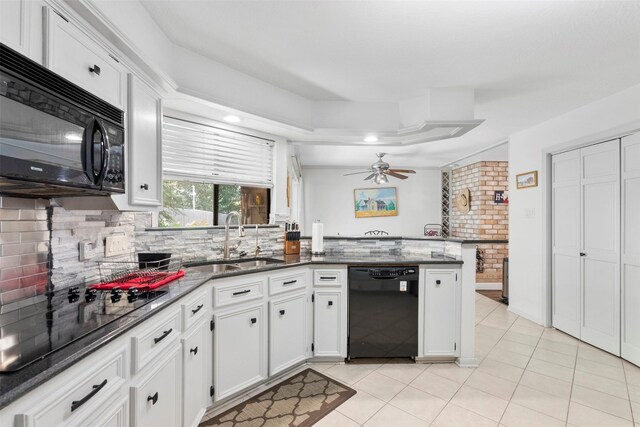 19511 Oak Station Dr, Humble, TX 77346 - kitchen featuring black appliances, light tile patterned flooring, a ceiling fan, backsplash, and white cabinets