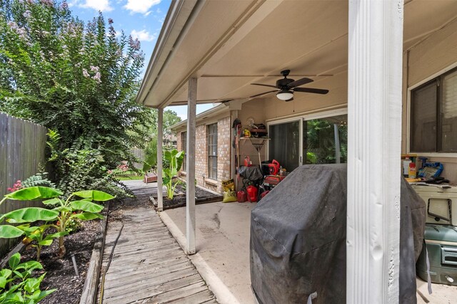 19511 Oak Station Dr, Humble, TX 77346 - fenced backyard with ceiling fan and a patio area