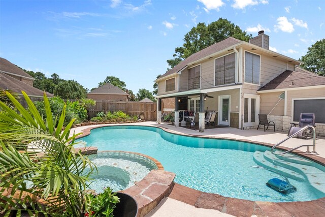 19511 Oak Station Dr, Humble, TX 77346 - view of swimming pool with french doors, a patio, a fenced backyard, a pool with connected hot tub, and ceiling fan