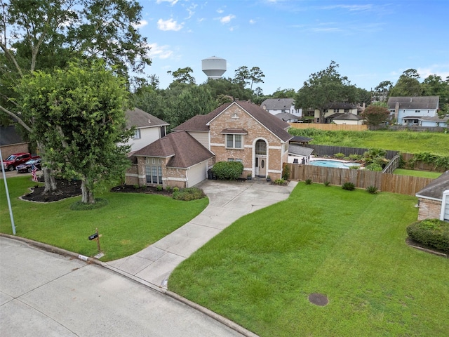 19511 Oak Station Dr, Humble, TX 77346 - traditional home featuring driveway, brick siding, an attached garage, and roof with shingles
