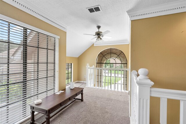 19511 Oak Station Dr, Humble, TX 77346 - carpeted entryway featuring a ceiling fan, ornamental molding, and a textured ceiling