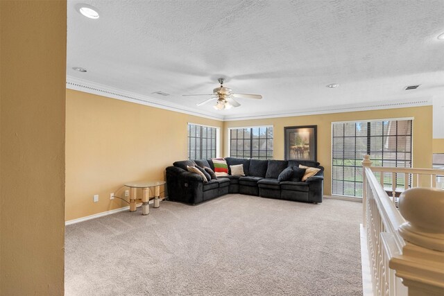 19511 Oak Station Dr, Humble, TX 77346 - living room featuring a ceiling fan, light carpet, ornamental molding, a textured ceiling, and recessed lighting