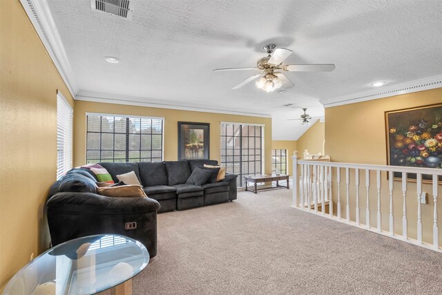 19511 Oak Station Dr, Humble, TX 77346 - living area featuring ornamental molding, carpet, a textured ceiling, and ceiling fan