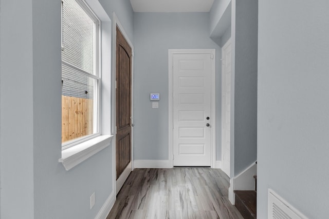 2811 Wichita St, Houston, TX 77004 - doorway featuring wood finished floors and baseboards