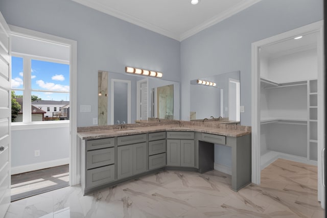 2811 Wichita St, Houston, TX 77004 - bathroom with double vanity, marble finish floors, a walk in closet, crown molding, and recessed lighting