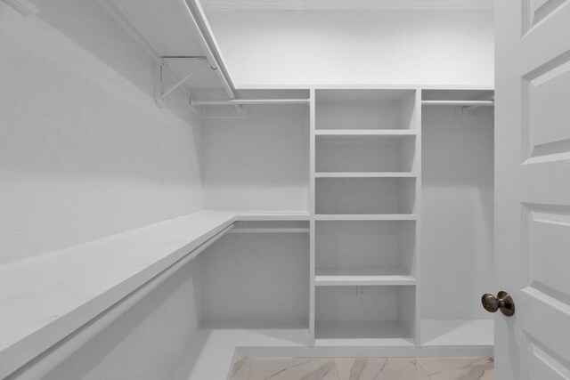 2811 Wichita St, Houston, TX 77004 - spacious closet featuring marble look tiles and built in desk