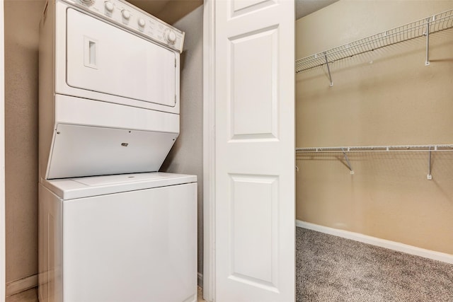 1330 Old Spanish Trl Unit 5106, Houston, TX 77054 - laundry room featuring stacked washer / drying machine and light colored carpet