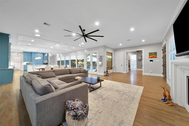 1353 Chantilly Ln, Houston, TX 77018 - living area with a ceiling fan, light wood-type flooring, a fireplace, recessed lighting, and healthy amount of natural light