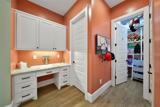 1353 Chantilly Ln, Houston, TX 77018 - home office featuring built in study area and light wood-style flooring
