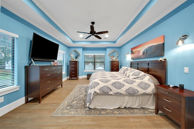 1353 Chantilly Ln, Houston, TX 77018 - bedroom with a raised ceiling, light wood-style floors, and ceiling fan