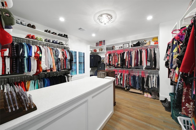 1353 Chantilly Ln, Houston, TX 77018 - walk in closet with light wood-style floors