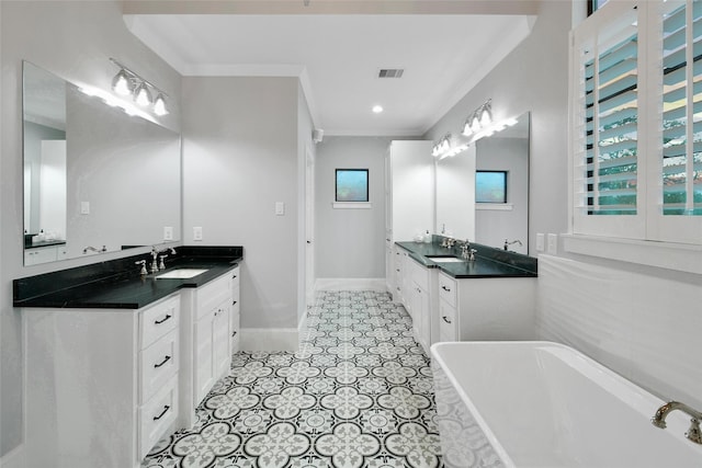 1353 Chantilly Ln, Houston, TX 77018 - bathroom featuring two vanities, a freestanding tub, ornamental molding, and tile patterned floors