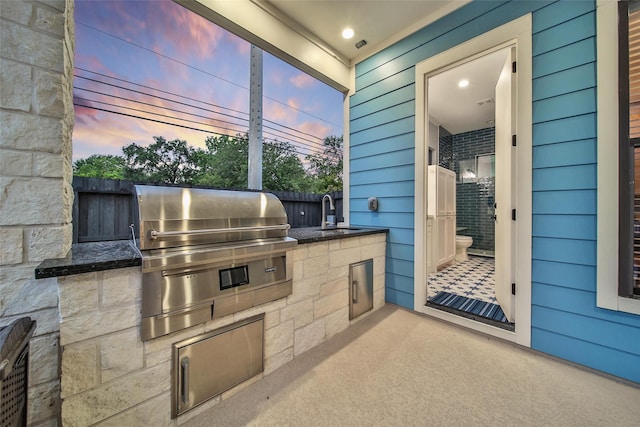 1353 Chantilly Ln, Houston, TX 77018 - patio terrace at dusk featuring an outdoor kitchen and a sink