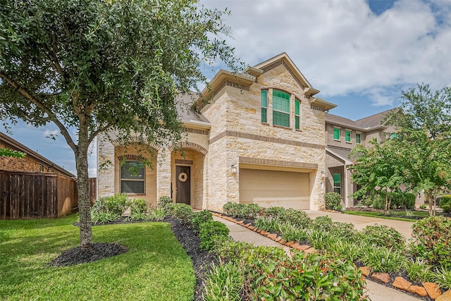 2526 Granberry Pt, Missouri City, TX 77459 - view of front of home featuring stone siding, concrete driveway, and a garage