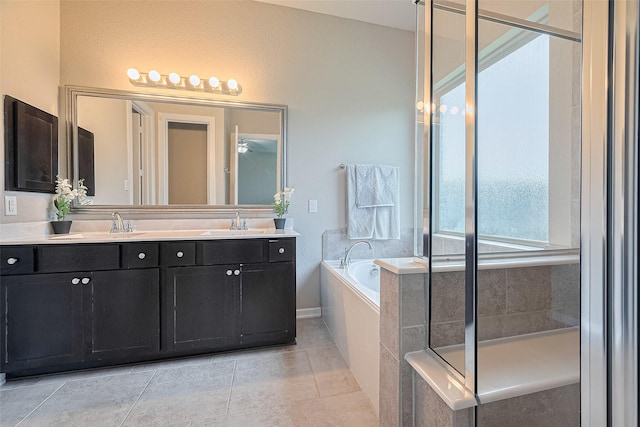 2526 Granberry Pt, Missouri City, TX 77459 - full bath featuring a bath, double vanity, tile patterned flooring, a shower stall, and ceiling fan