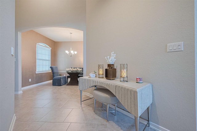 2526 Granberry Pt, Missouri City, TX 77459 - office area featuring arched walkways, a chandelier, light tile patterned flooring, and a textured wall