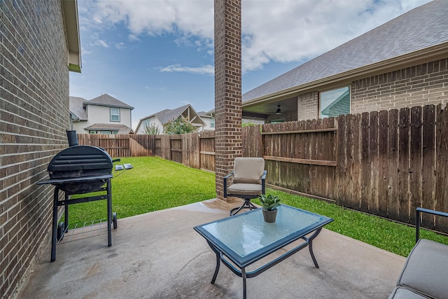 2526 Granberry Pt, Missouri City, TX 77459 - fenced backyard featuring a grill and a patio area