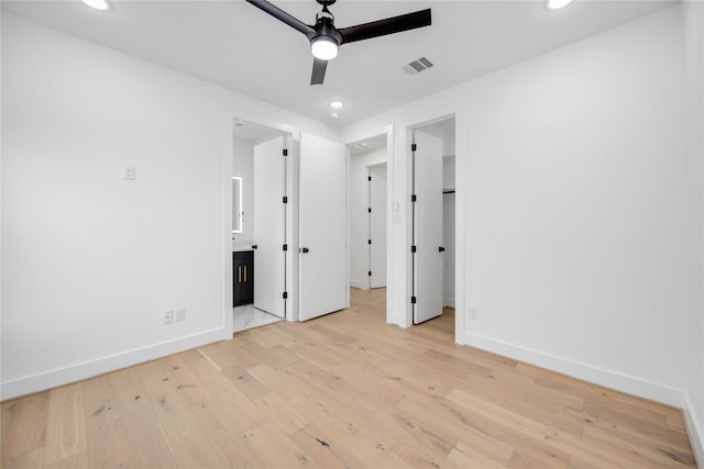 2506 Tierwester St, Houston, TX 77004 - unfurnished bedroom featuring recessed lighting, light wood-style floors, ensuite bath, a spacious closet, and a ceiling fan