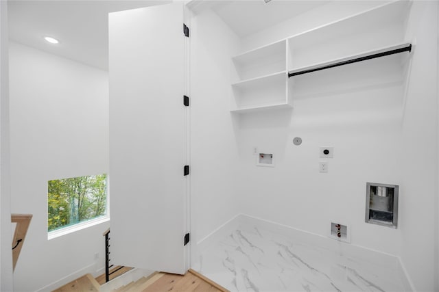 2506 Tierwester St, Houston, TX 77004 - washroom with electric dryer hookup, hookup for a gas dryer, washer hookup, recessed lighting, and light marble finish floors