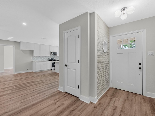 2515 Garapan St, Houston, TX 77091 - entrance foyer with light wood-type flooring and baseboards