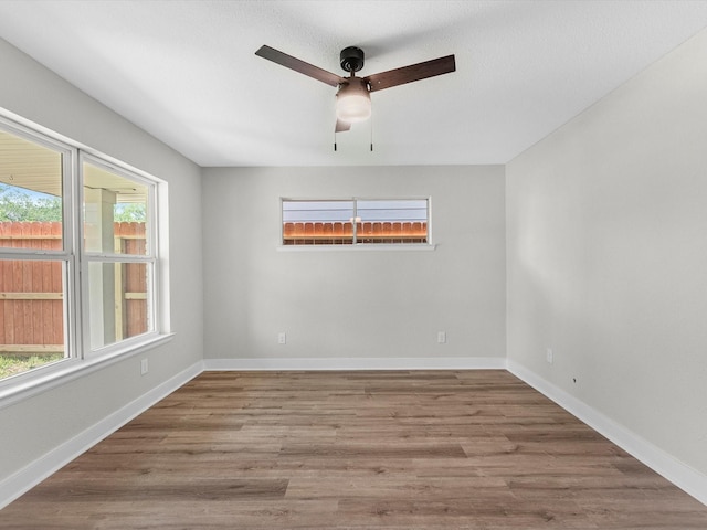 2515 Garapan St, Houston, TX 77091 - unfurnished room with ceiling fan and wood finished floors