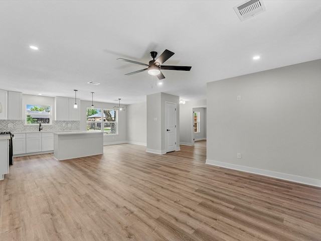 2515 Garapan St, Houston, TX 77091 - unfurnished living room featuring a ceiling fan, light wood-style flooring, and recessed lighting
