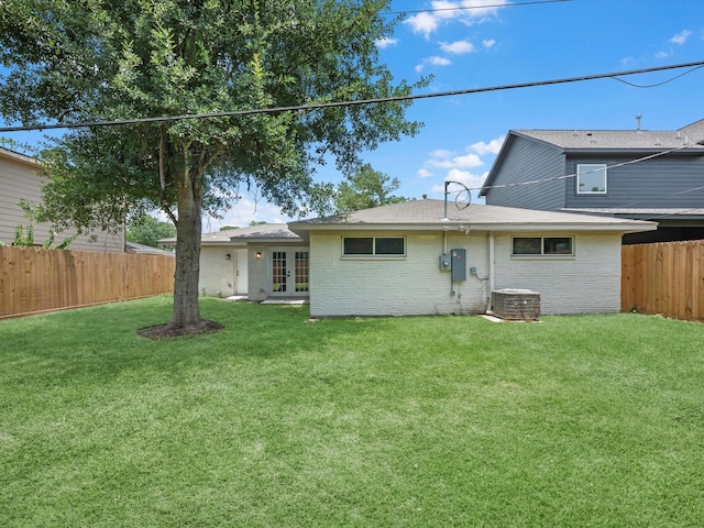 2515 Garapan St, Houston, TX 77091 - back of house with french doors, a fenced backyard, and brick siding