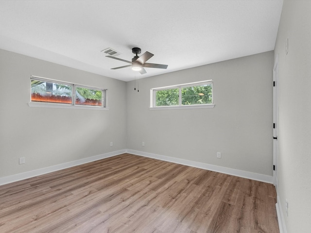 2515 Garapan St, Houston, TX 77091 - spare room featuring light wood finished floors and a ceiling fan