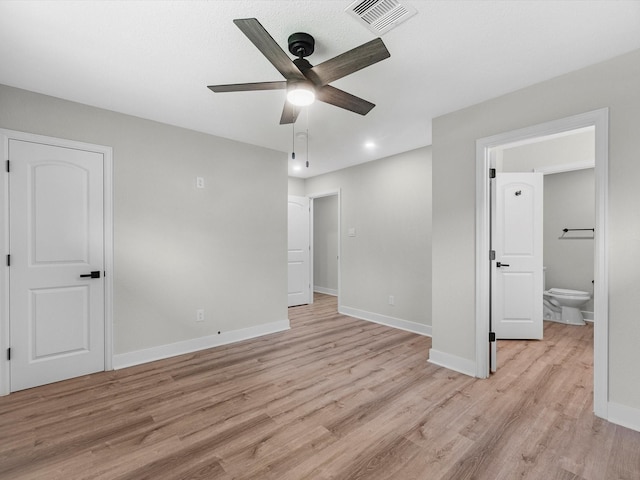 2515 Garapan St, Houston, TX 77091 - unfurnished bedroom featuring light wood-style floors, connected bathroom, a ceiling fan, and recessed lighting