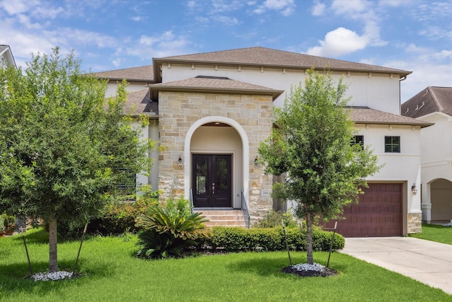 3310 Glen Haven Blvd, Houston, TX 77025 - view of front of property with stone siding, an attached garage, a front yard, and driveway