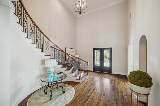 3310 Glen Haven Blvd, Houston, TX 77025 - entrance foyer with french doors, stairs, a towering ceiling, wood finished floors, and crown molding