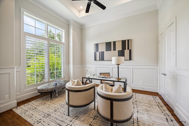 3310 Glen Haven Blvd, Houston, TX 77025 - sitting room featuring a decorative wall, ceiling fan, wood finished floors, crown molding, and a wainscoted wall