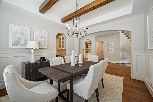 3310 Glen Haven Blvd, Houston, TX 77025 - dining room with arched walkways, a chandelier, dark wood-style flooring, beam ceiling, and stairs
