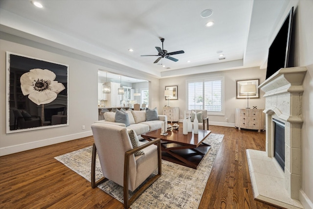 3310 Glen Haven Blvd, Houston, TX 77025 - living area with a fireplace, ceiling fan, wood finished floors, recessed lighting, and a raised ceiling