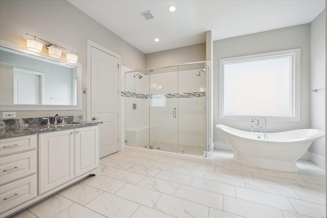 3310 Glen Haven Blvd, Houston, TX 77025 - full bathroom featuring vanity, a shower stall, marble finish floors, a freestanding tub, and recessed lighting