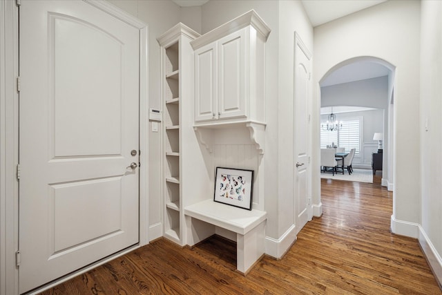 3310 Glen Haven Blvd, Houston, TX 77025 - mudroom with wood finished floors, arched walkways, and a chandelier
